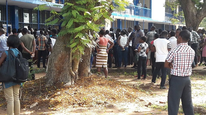 Some of the job seekers preparing to write the test at PRESEC Legon.